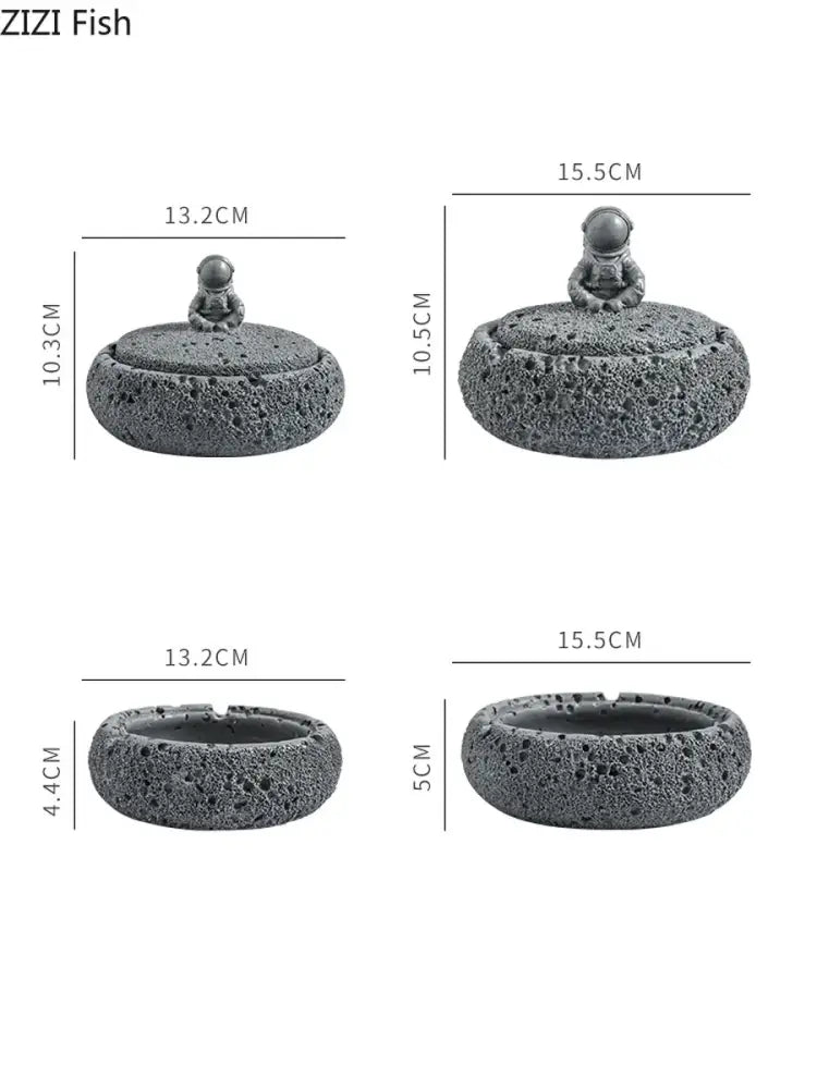 Gray volcanic stone cement astronaut ashtray with textured surface and small astronaut figurine for living room use