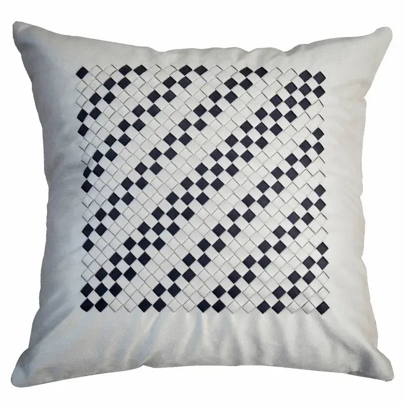 A square white cushion with a bold black and white woven diamond pattern gray faux rex rabbit fur decorbites gray faux cover