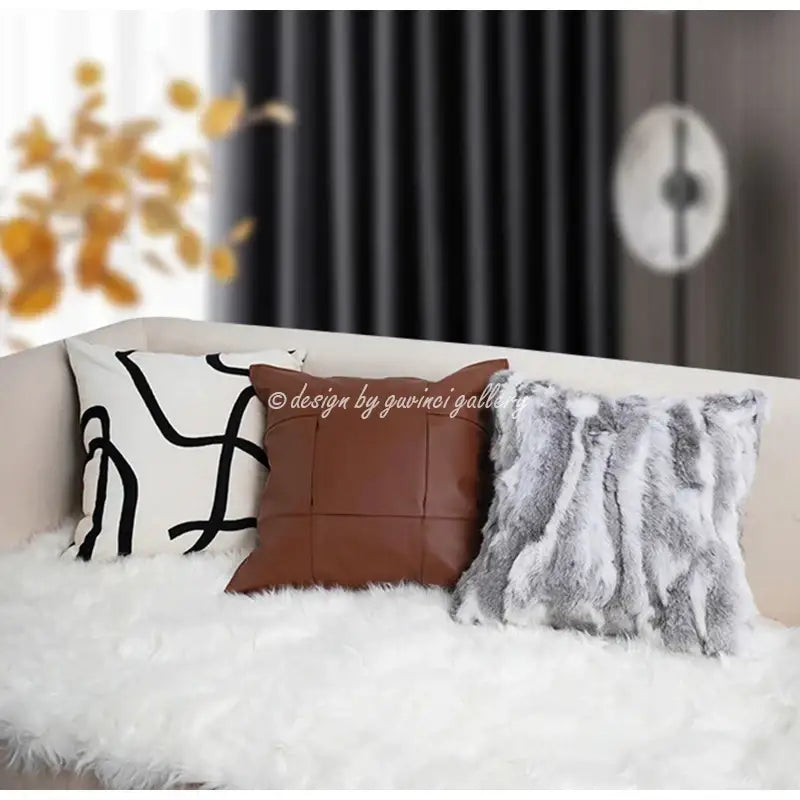 Three decorative throw pillows on white fur sofa include a gray faux rex rabbit fur cushion cover for living room decorbites gray faux