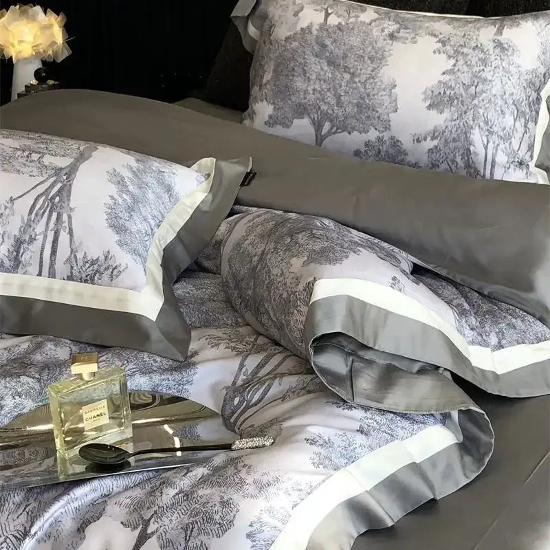 Gray and white satin bedding set with forest toile jungle print flowers and elegant contrasting trim by decorbites