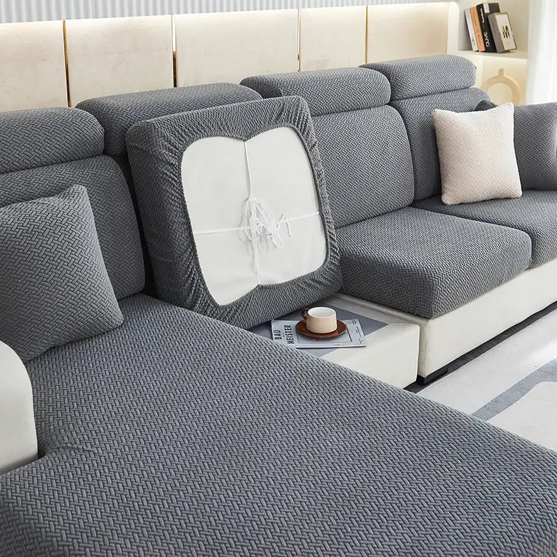 Gray herringbone-patterned decorbites jacquard velvet sofa cover with white insert and elasticized edges for living room