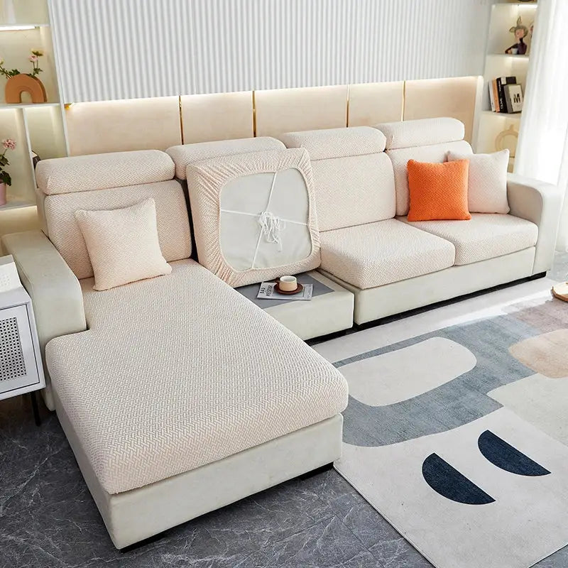 Beige textured sofa cover with elasticized edges and central cutout for easy fitting decorbites jacquard velvet sofa