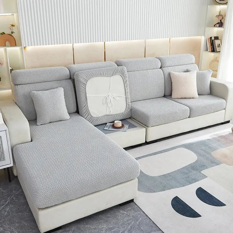 Light gray herringbone decorbites jacquard velvet sofa cover with white central panel and ribbon tie for living room decor