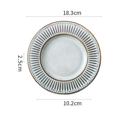 White ceramic plate with textured rim, black radial lines, and gold accents from decorbites ceramic wedding tableware set