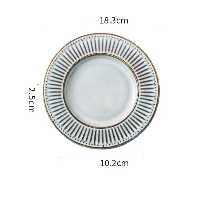 White ceramic plate with textured rim, black radial lines, and gold accents from decorbites ceramic wedding tableware set