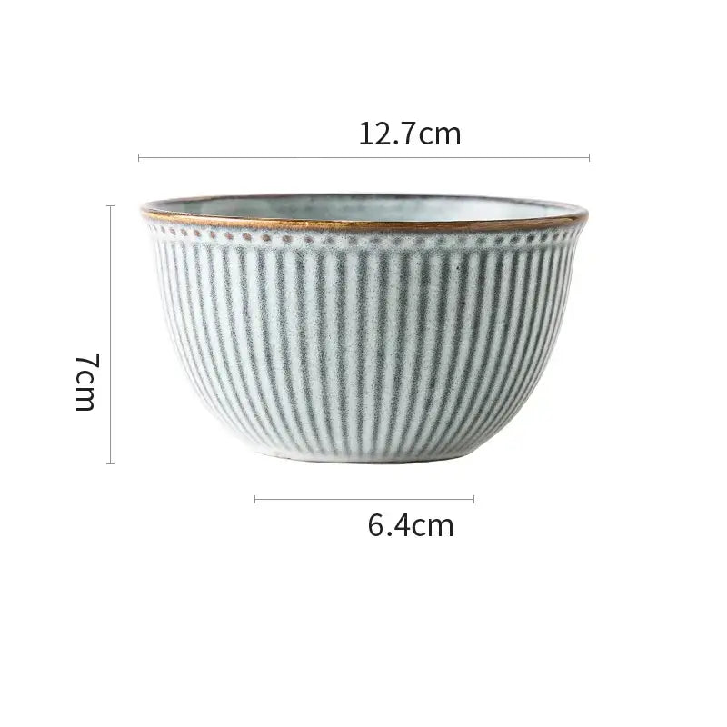A ceramic wedding tableware bowl with vertical ridges, muted sage green glaze, gold rim from a decorbites set