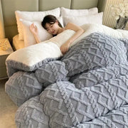 A plush gray and white two-toned fleece cozy winter bed blanket with textured diamond pattern for decorbites cozy winter decor