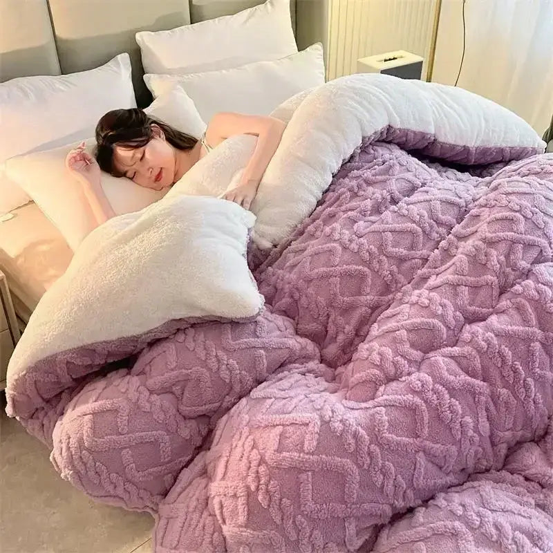 A plush lavender quilt with textured diamond pattern and white sherpa lining perfect for decorbites cozy winter bed blanket