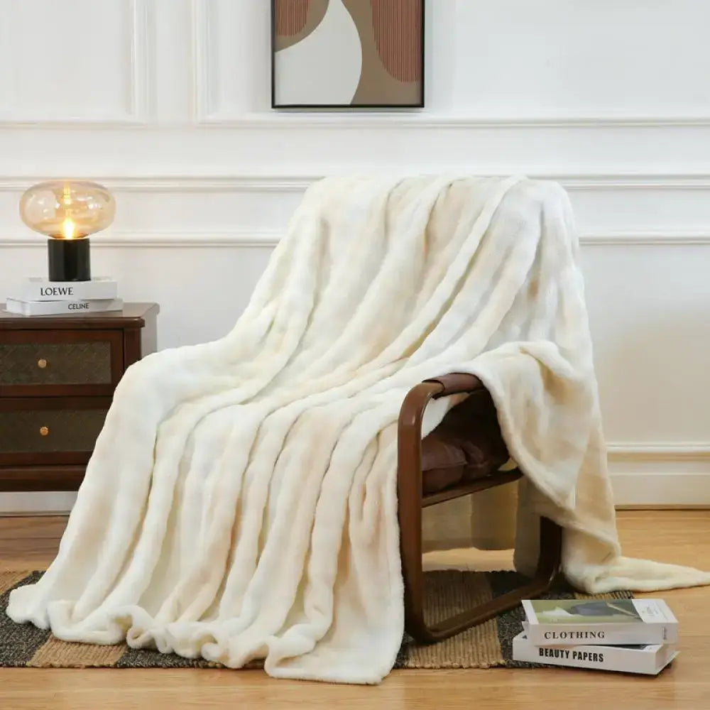 Cream-colored plush throw blanket draped over wooden chair featuring decorbites fuzzy faux fur bedroom decor