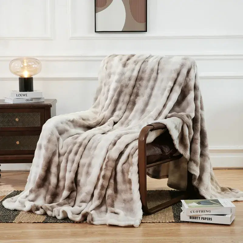 A soft beige and gray mottled fuzzy faux fur blanket decorbites fuzzy faux bedroom throw for cozy decor
