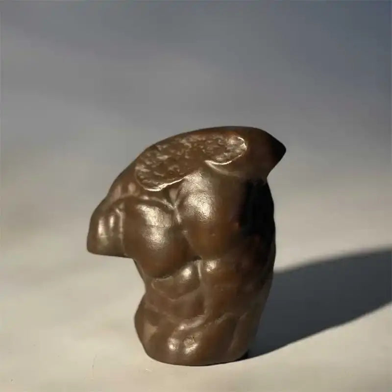 Bronze-colored greek nude human figure bust sculpture with muscular torso and detailed abdominal texture for living room decor