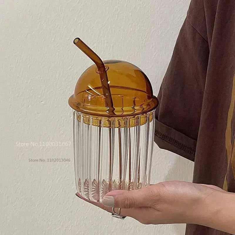 A clear ribbed glass cup with amber dome lid and straw from decorbites 450ml striped glass kitchenware