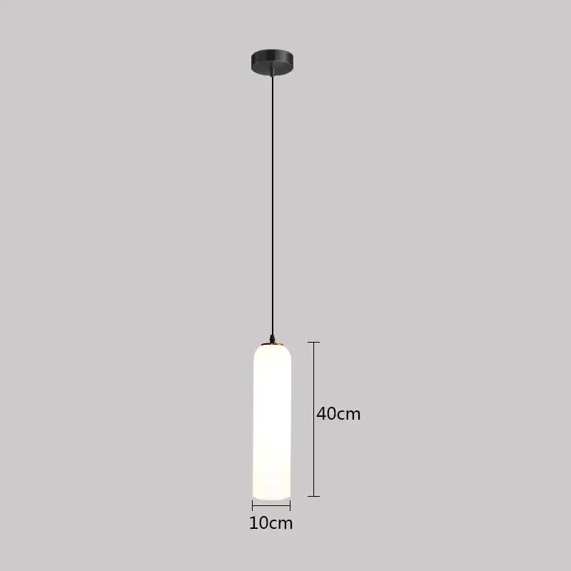 Minimalist black pendant light with frosted glass cylinder diffuser and matte metal hardware for green glass nordic decor