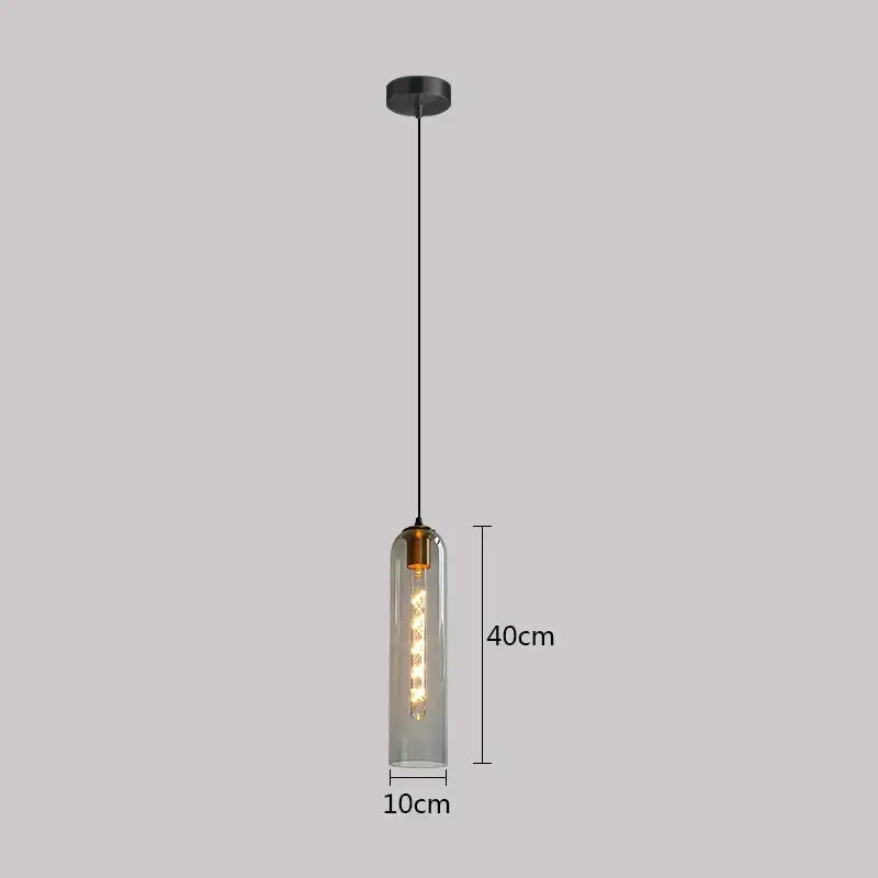 A sleek 40cm tall green glass nordic pendant light with clear glass body and exposed edison bulb for living room