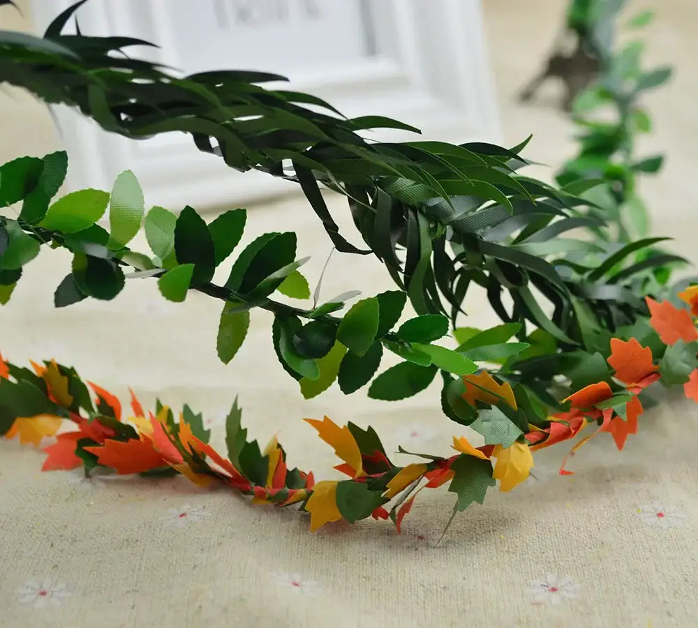 Decorative green and orange artificial leaf vine wreath garland for autumn living room decor