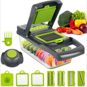 Green and black multi-functional vegetable slicer cutter with interchangeable blades and basket for kitchen use