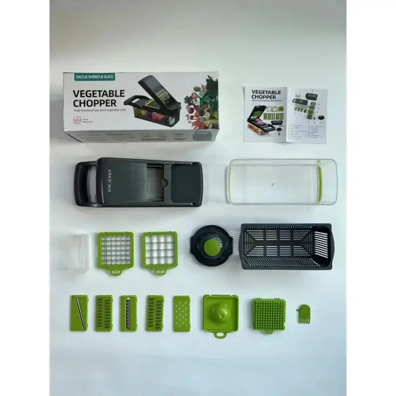 Green and black vegetable slicer cutter grater with basket features interchangeable blades and clear collection tray for slicing