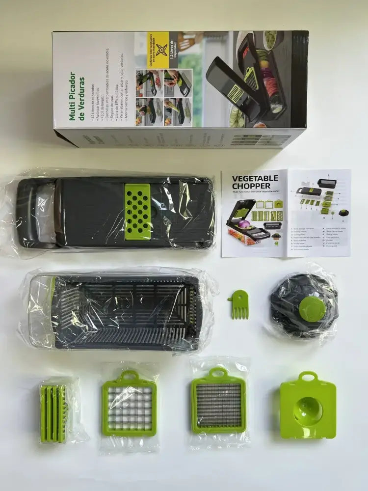 Black and lime green vegetable slicer cutter grater with interchangeable blades in clear plastic packaging for kitchen use