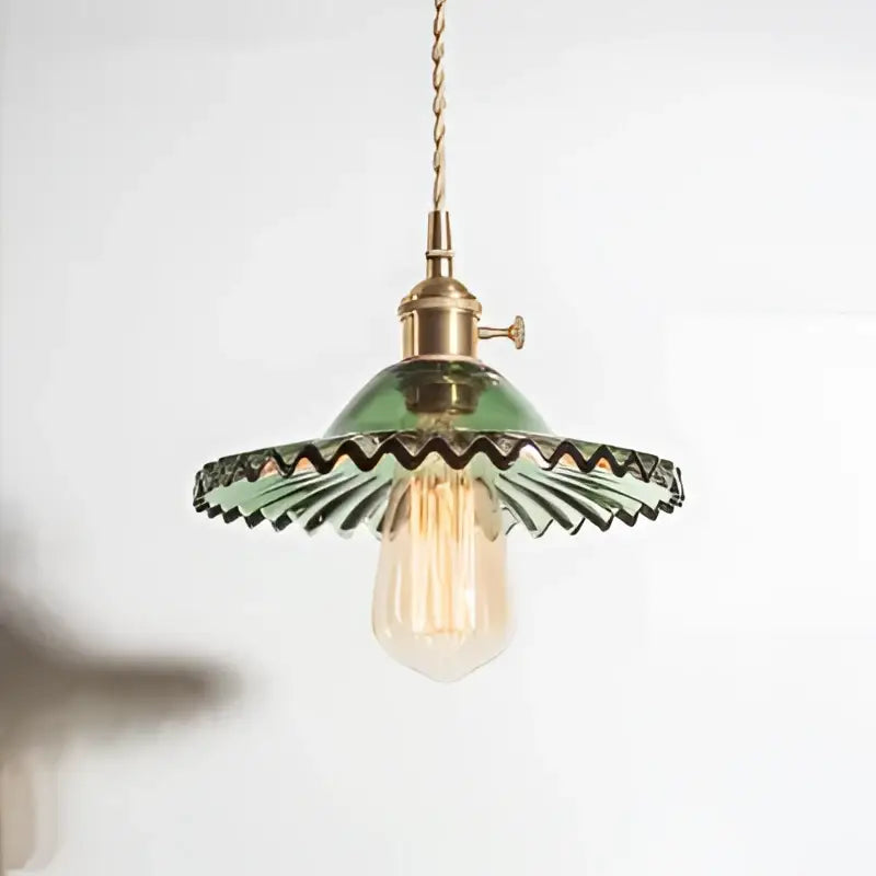 Green glass pendant light with exposed edison bulb and brass decorbites copper base for dining room decor