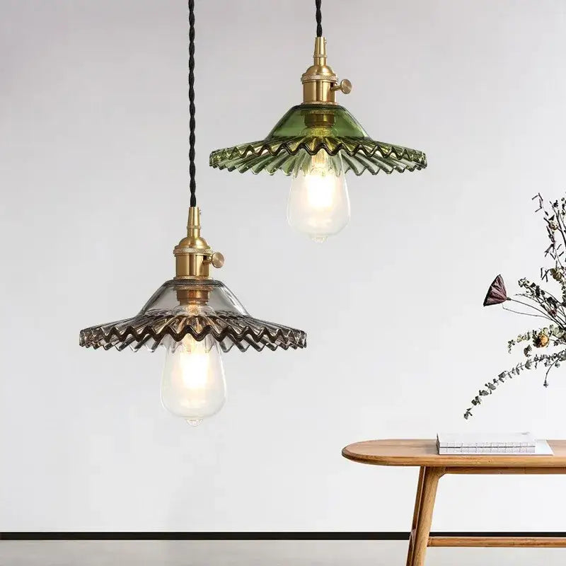 Green and clear glass pendant light with brass fixtures featuring decorbites copper base glass for dining room decor