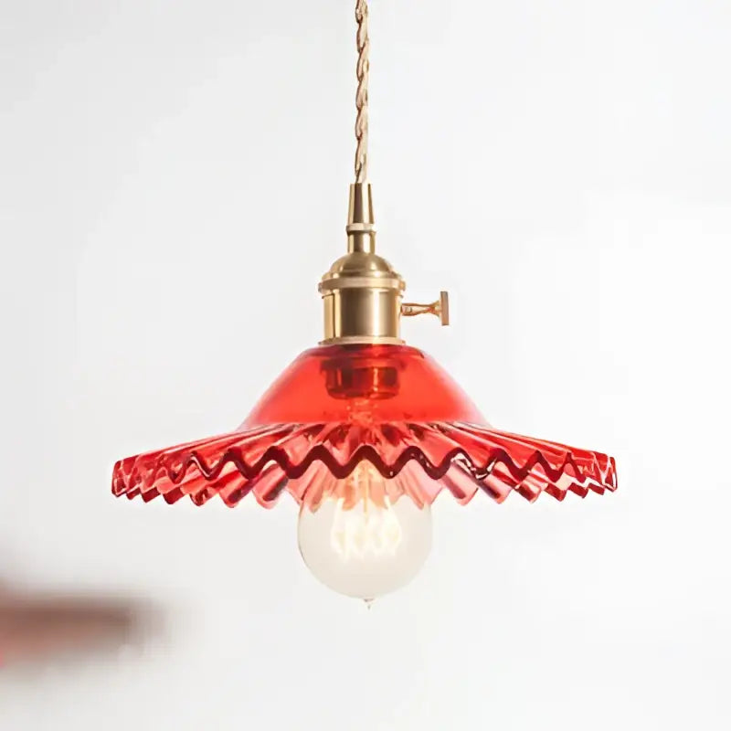 Red glass pendant light with wavy scalloped edge and brass decorbites copper base for dining room decor