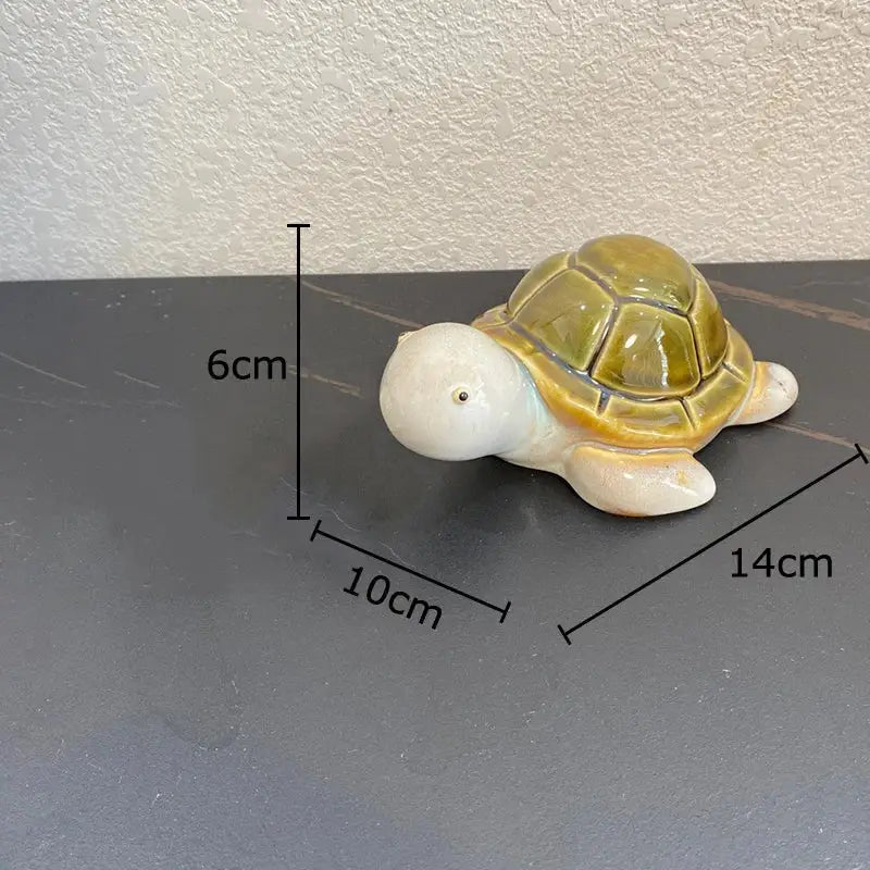Green and cream ceramic cute turtle statue tray with a glossy olive-green shell for living room decor