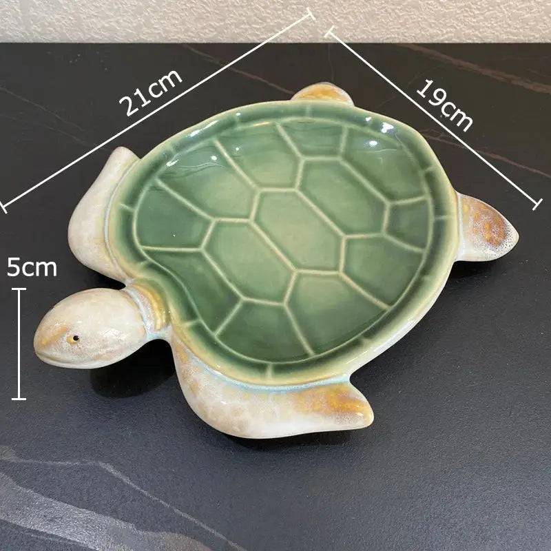 Green and cream ceramic cute turtle statue tray with glossy shell and yellow accents for living room decor