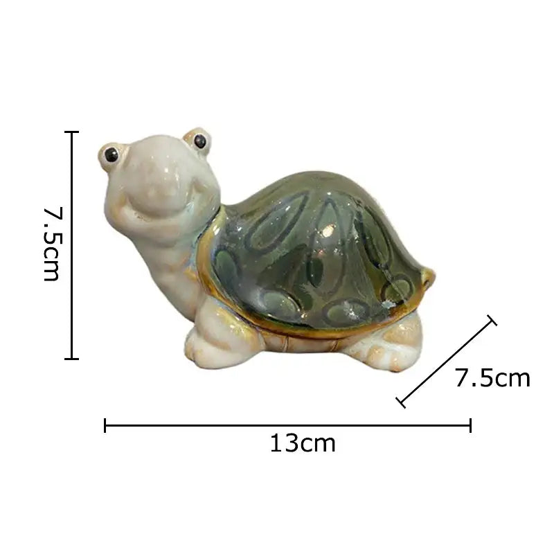 Green and cream ceramic cute turtle statue with glossy green shell and black bead eyes for living room decor tray