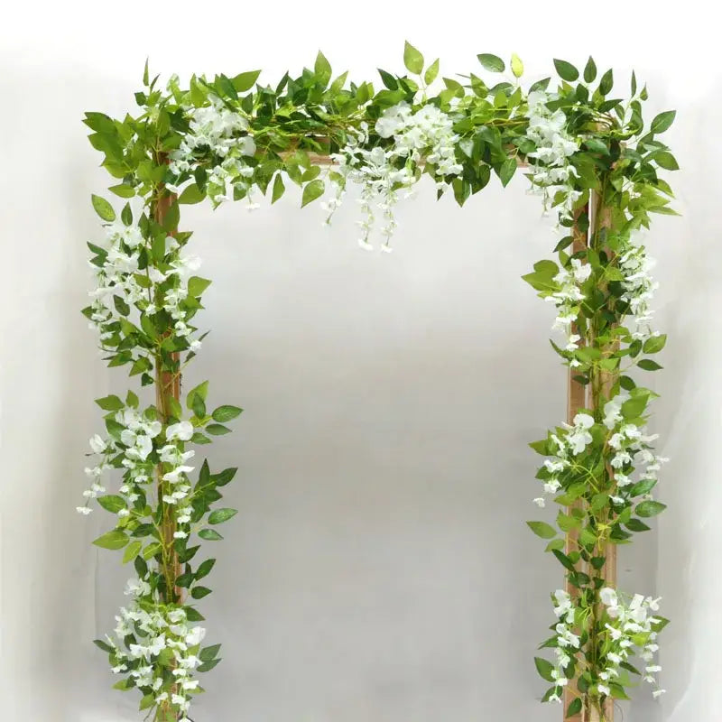 Green and white artificial flowers garden wedding arch decor with lush vines and delicate blossoms by decorbites artificial flowers