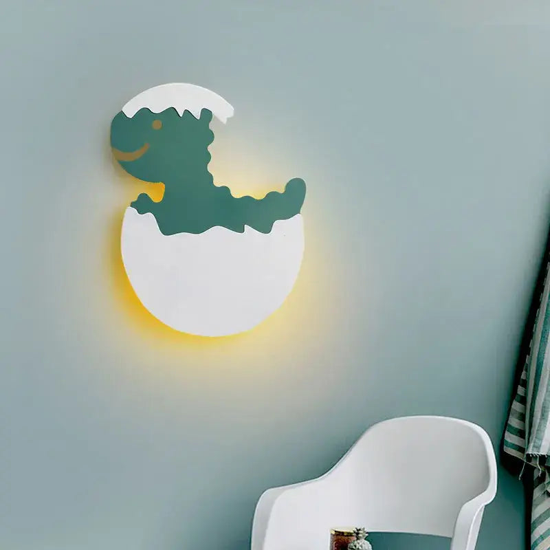 Green and white dino egg led wall lamp with cheerful green dinosaur hatching and warm yellow light decorbites dino egg decor