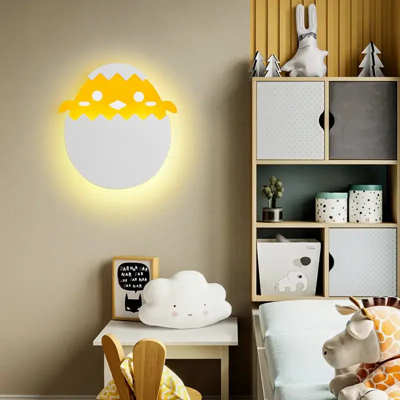 Yellow and white egg-shaped wall lamp with smiling chick design as decorbites dino egg led bedroom night light