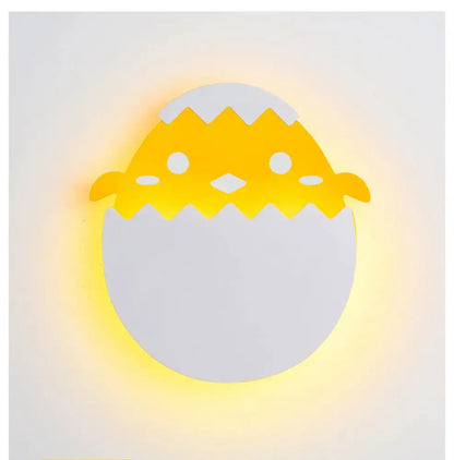 A charming yellow and white chick wall lamp with soft glow featured as decorbites dino egg led bedroom night light