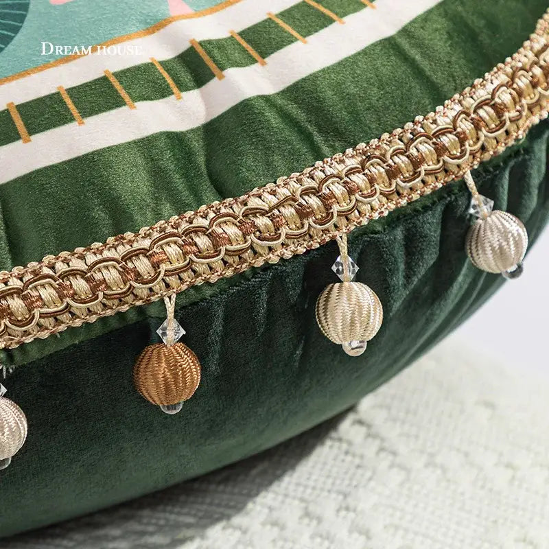 Gold-toned braided trim with tassels and crystals on green and white geometric tufted embroidery cushion cover decorbites