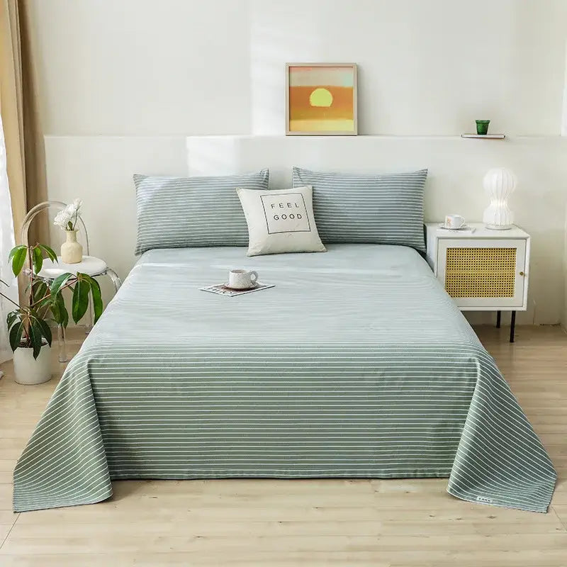 A soft mint green and white thin striped printed cotton bedspread for bedroom decor from decorbites cartoon printed collection