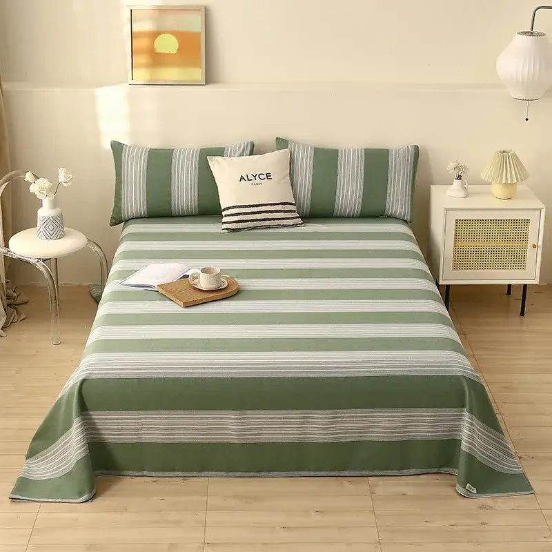 Green and white striped cartoon printed cotton bedspread with woven texture and embroidered alyce paris accent pillow