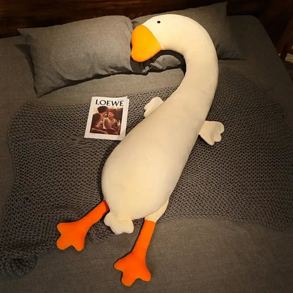 A plush white goose body pillow with orange beak and feet made of soft fabric for decorbites cartoon animal decor