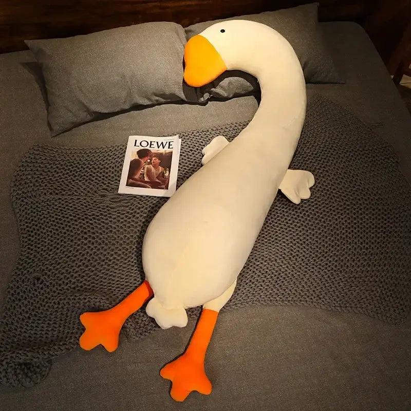 A plush white goose body pillow with orange beak and feet made of soft fabric for decorbites cartoon animal decor