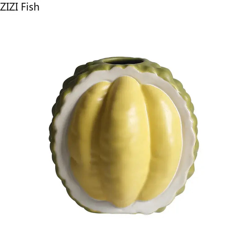 Green and yellow durian ceramic vase shaped like sliced durian with vibrant flesh and outer husk for table decor
