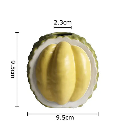 Green and yellow durian ceramic vase shaped like a halved durian with vibrant flesh for table decor and living room use