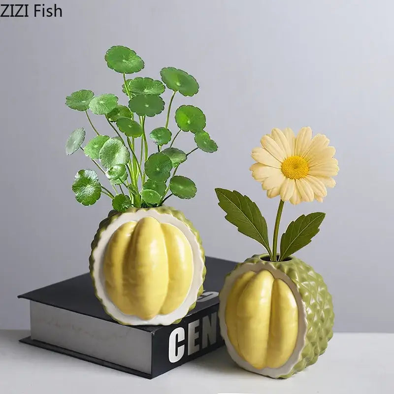 Two green and yellow durian ceramic vases with textured exterior for living room decor in a matching set
