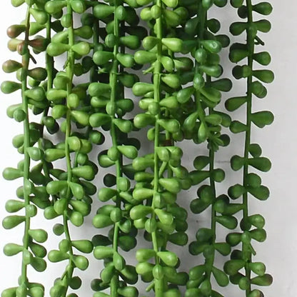 Green artificial fern vine hanging plant with glossy bead-like leaves for living room decor