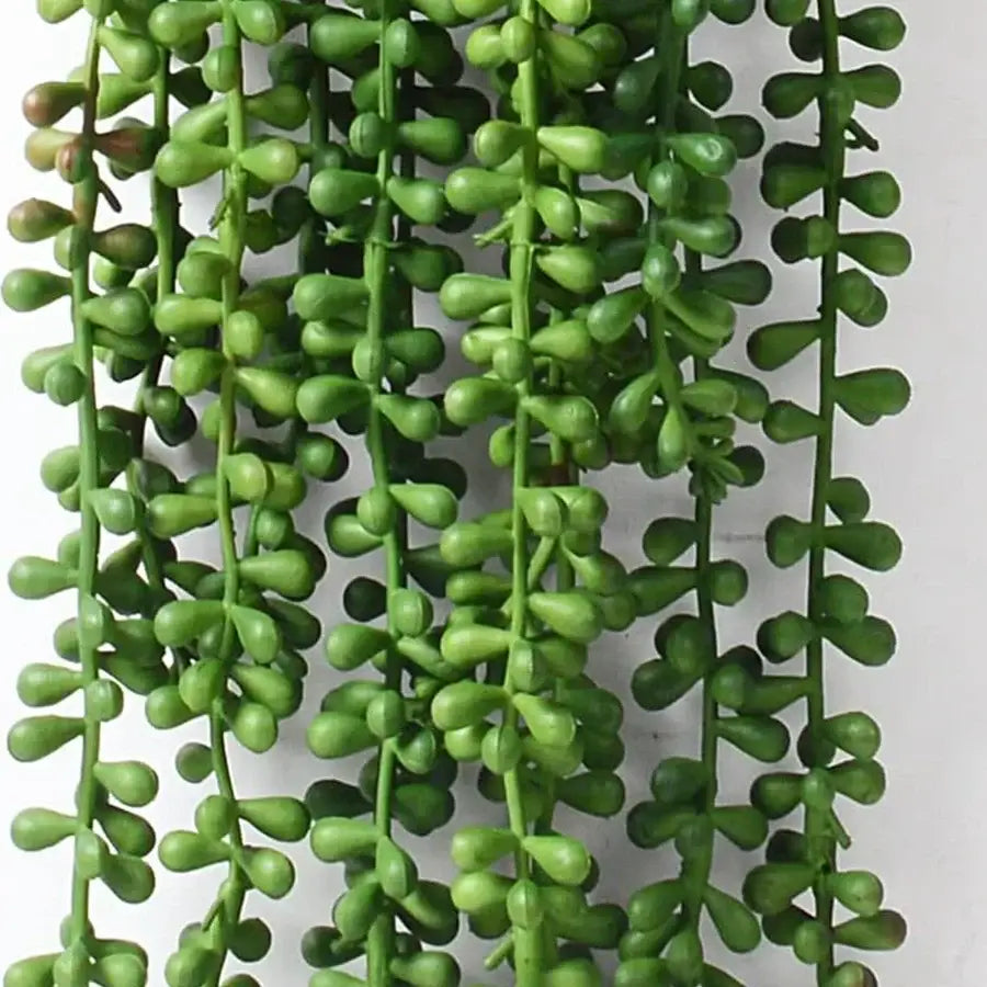 Green artificial fern vine hanging plant with glossy bead-like leaves for living room decor
