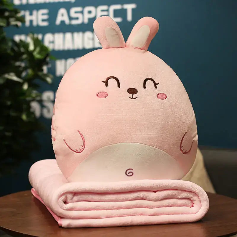 Pink plush bunny-shaped hand warmer with embroidered face and matching pink blanket for decorbites cartoon animal pillow blanket decor