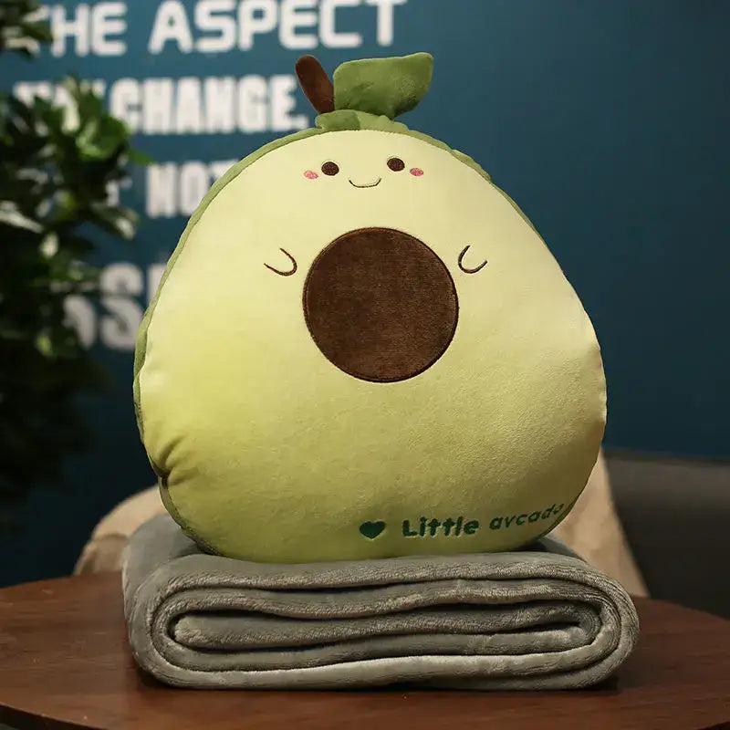 A soft light green plush avocado cartoon animal throw pillow blanket with a brown embroidered pit for decorbites bedroom decor