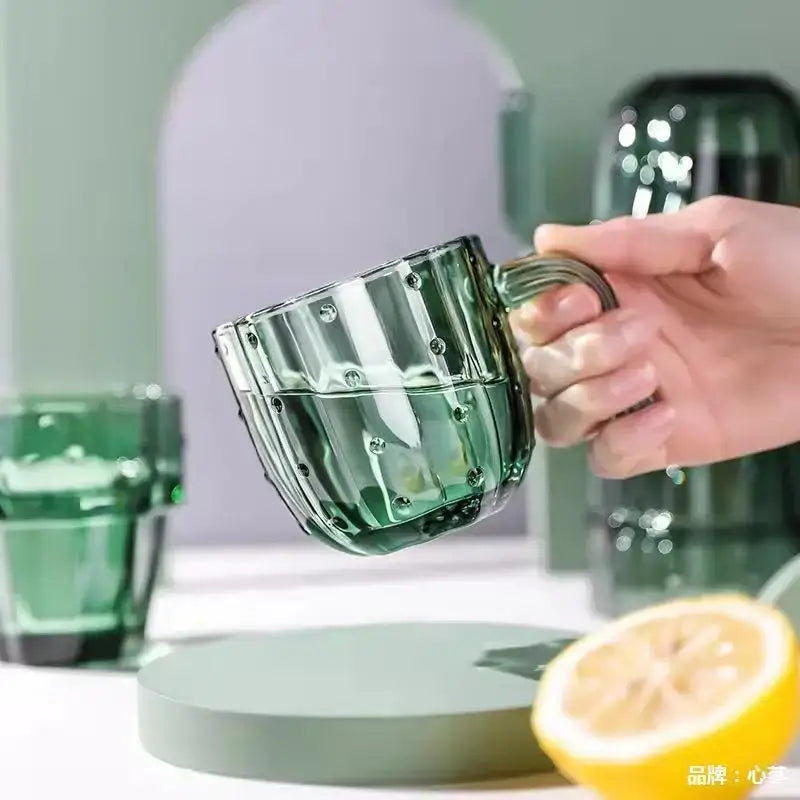 Translucent green glass mug with textured ridges and circular embellishments decorbites cactus glass mug for kitchen use