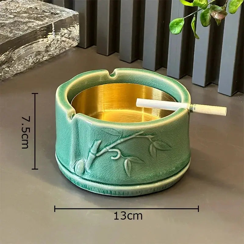 Green ceramic bamboo tissue box with embossed bamboo design and gold interior ideal for living room decor