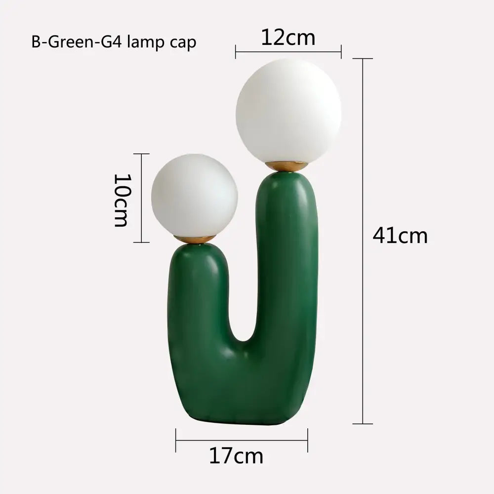 Dark green ceramic table lamp with double frosted glass white spherical shades for bedroom use