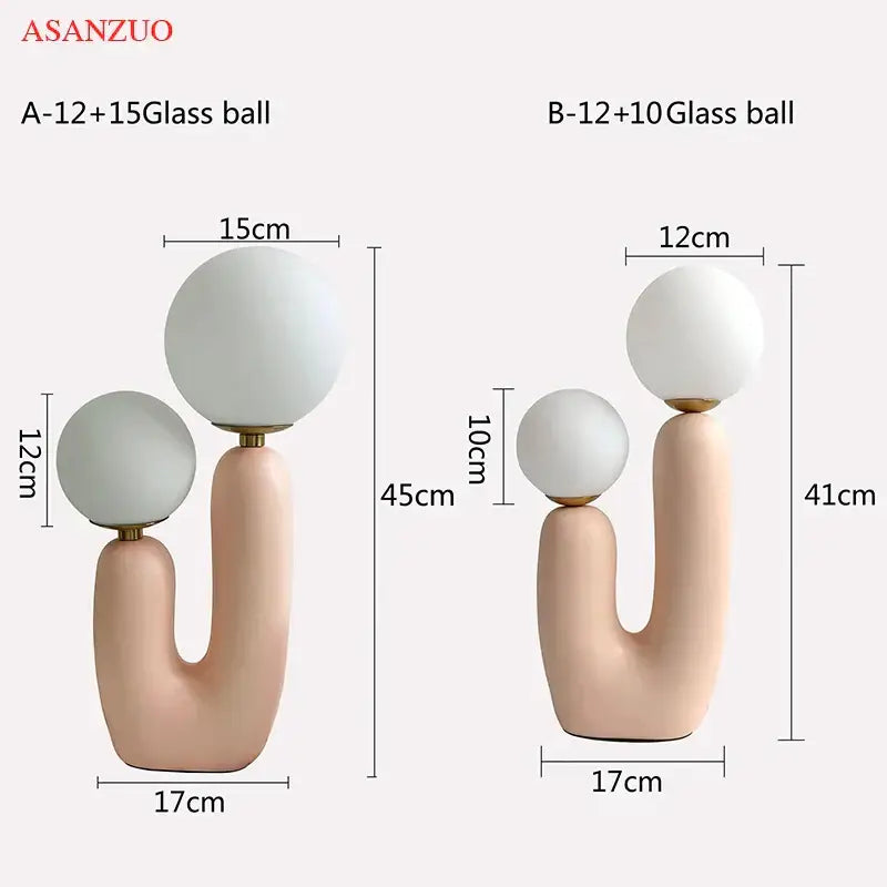 Pastel pink ceramic table lamp with double frosted glass spheres ideal for bedroom lighting