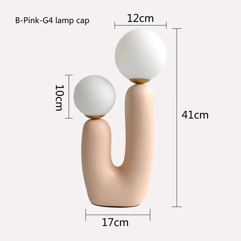 Pastel pink ceramic table lamp with double frosted glass globe shades for bedroom use