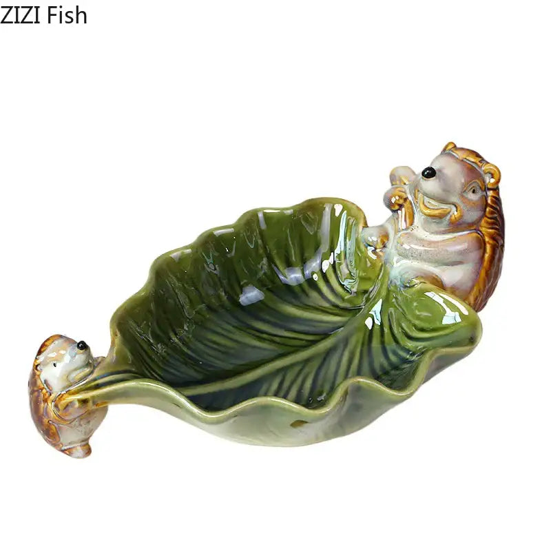 Green ceramic leaf decor tray with glossy ceramic leaf and whimsical porcupines for dining room storage by decorbites